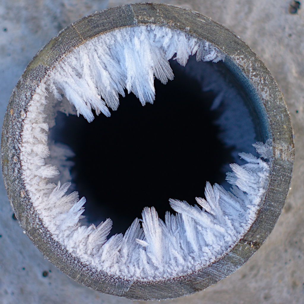 Frozen indoor pipes in residential plumbing system during winter