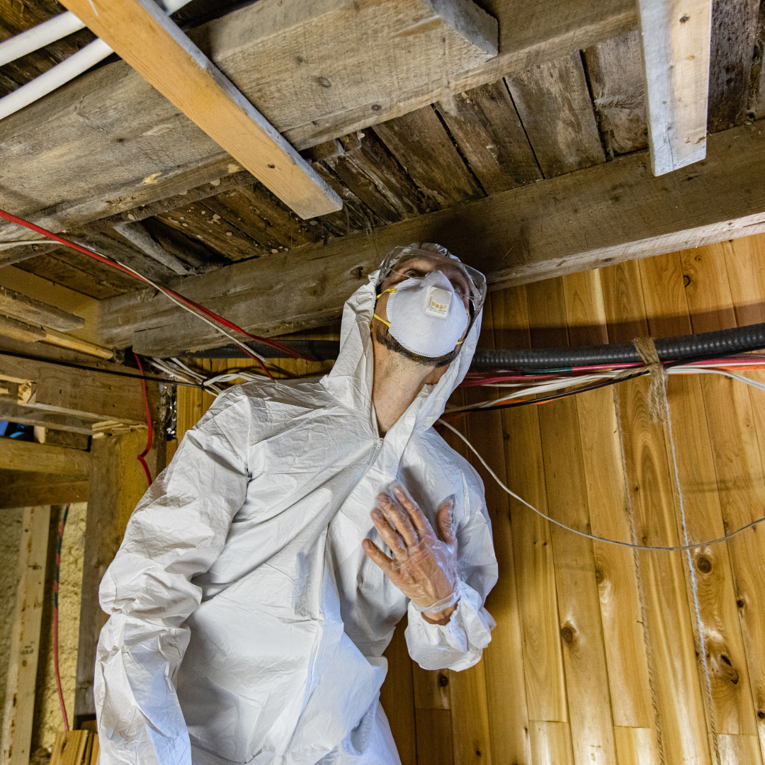 Technician performing indoor air quality testing in commercial building